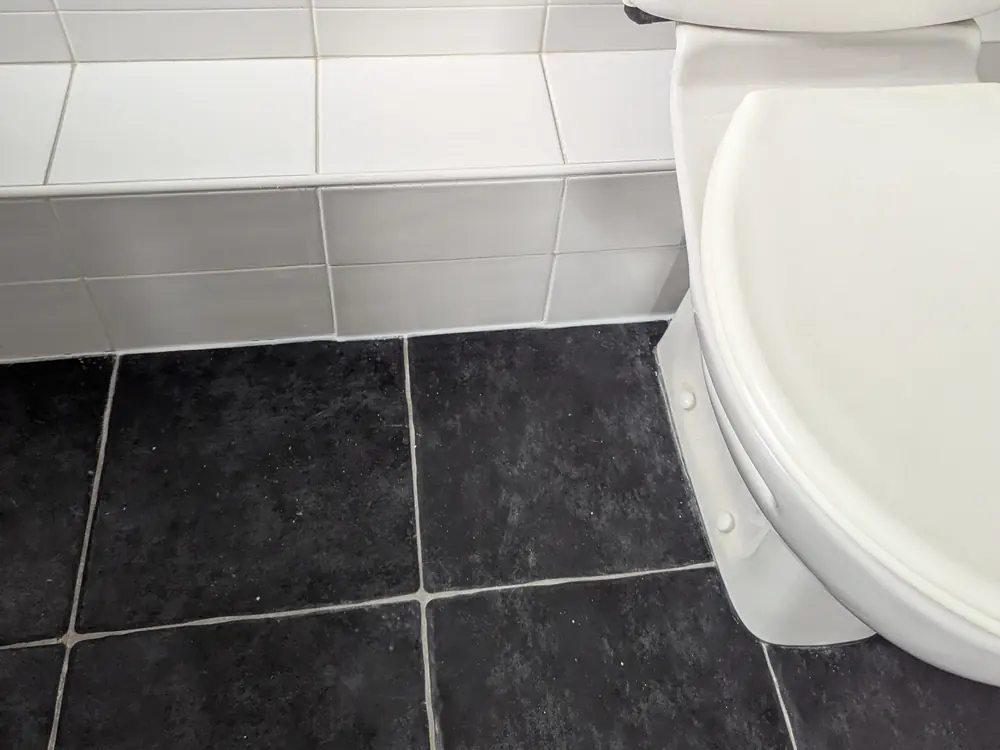 The same bathroom floor tiled and finished