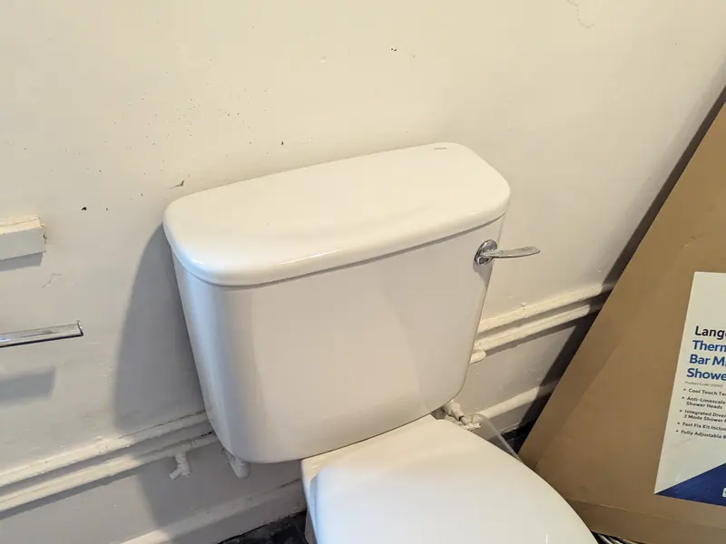 Toilet and cistern fitted in a bathroom